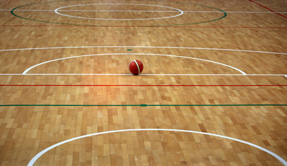 basketball court with a wooden parquet and a ball
