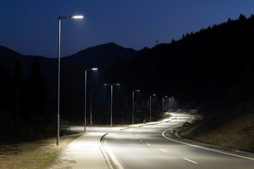 modern streetlights with LED technology at night, empty modern road