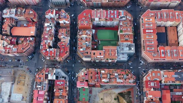 Aerial Drone Video Of Barcelona Spain. Streets Of Expansion District. Hospital De Sant Pau. Video Footage. The Cam Turns Down Vertically To The Street. Courtyard With A Football Field