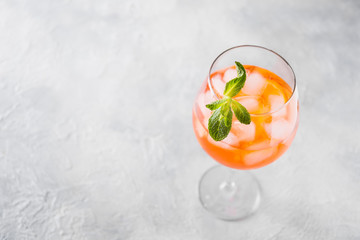 Classic Italian aperol spritz cocktail on light.
