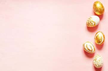 Top view of easter eggs colored with golden paint in differen patterns. Copy space. - Image