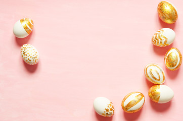 Top view of easter eggs colored with golden paint in differen patterns. Copy space. - Image