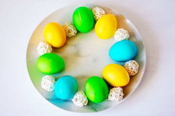 Easter eggs multicolored isolated on white background. Minimal easter concept. Happy easter card with copy space for text. Top view, flat.