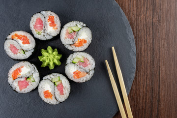 Rolls Yin Yang top view on the slate Board. Copy space