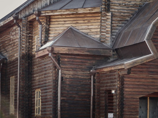 Fototapeta na wymiar Christian wooden temple closeup. Christian church. Orthodox. Log building. Architectural background. Ust-Kamenogorsk (Kazakhstan)