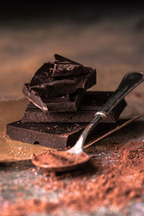 chocolate stack and cocoa powder in a teaspoon