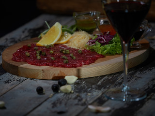 Carpaccio with meat sauces.