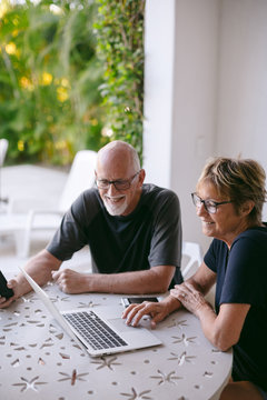 Couple using technolgy at home