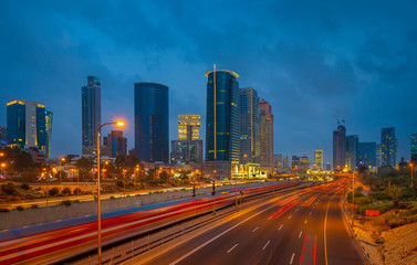 Fototapeta na wymiar Sunset view of Ayalon highway over Ramat Gun skyscrapers in Tel Aviv , Israel.