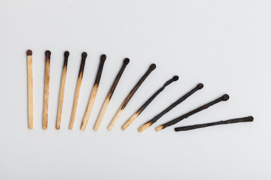 Matches forming falling sequence on slightly gray background