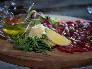 Carpaccio with meat sauces.