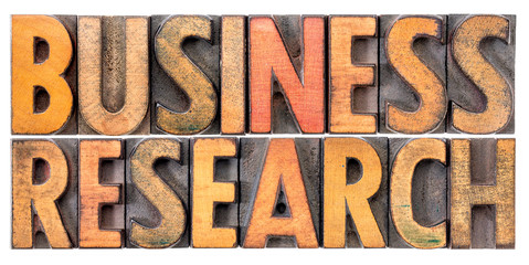 business research word abstract in wood type