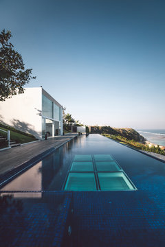 luxury villa with huge swimming pool on a cliff with ocean view