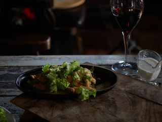 Portion of meat sprinkled with white sauce.