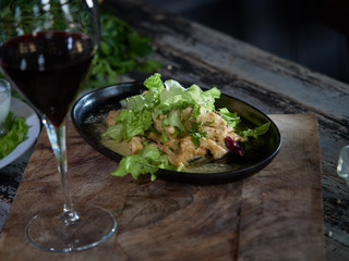 Portion of meat sprinkled with white sauce.