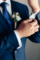 hands of the groom who is preparing for the wedding 1