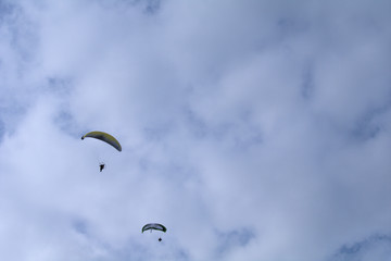 paraglider in the sky,fly, sport,sky, parachute,cloud, flight, high, paraglide, wind, sports, fun,, freedom, adventure, glider, 