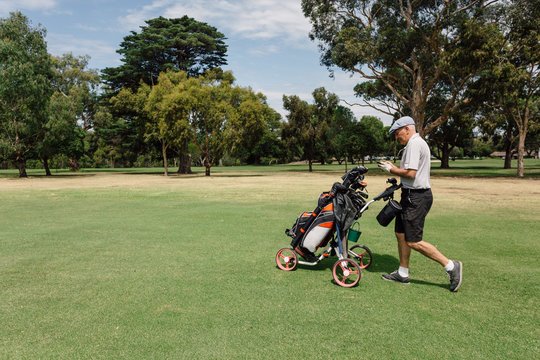 Senior man playing golf on the public golf course