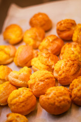 Delicious eclairs. Bakery in the oven. Confectionery. Yellow small ecriles