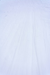 Obraz premium Ski track on a snow at sunset, Close up, copy space, The concept of winter sports.