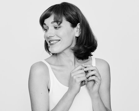 Amazing 35 y/o mature woman portraits in clean minimal fresh studio setup monochrome.