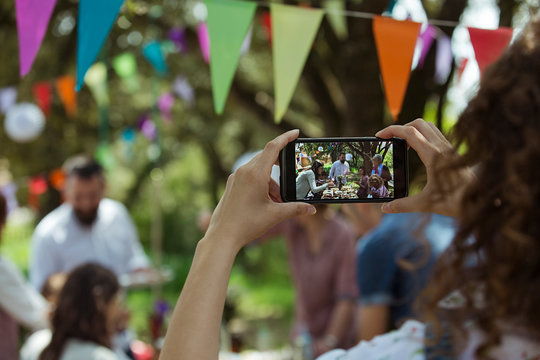 Woman take a photo of her big family