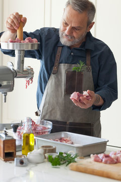 Man Making Sausages at Home