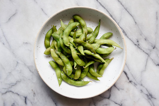 Bowl of steamed edamame beans with sea salt