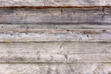 Gray wall, wooden texture of old beams