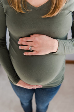 woman holding her beautiful pregnant belly