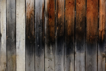 The old gray wall of the boards, the dark texture