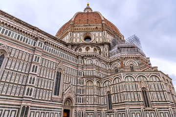 Florence Cathedral - A close-up low-angle view of the dome and south exterior wall of the Cathedral...