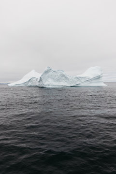 Iceberg In Calm Water