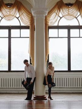 Dancers in ballroom?preparing shoes