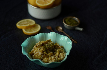 Green pumpkin salad with rice,lemon and mint on dark background. Vegetarian food 