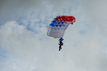 man with parachute in the sky