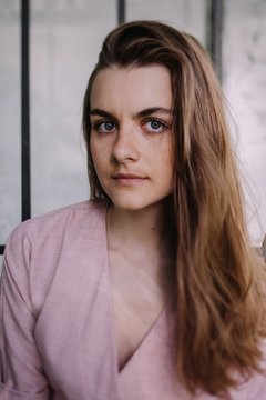 Portrait of lovely young woman with long hair