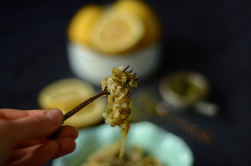 Green salad with pumpkin, dill and rice on rustic background
