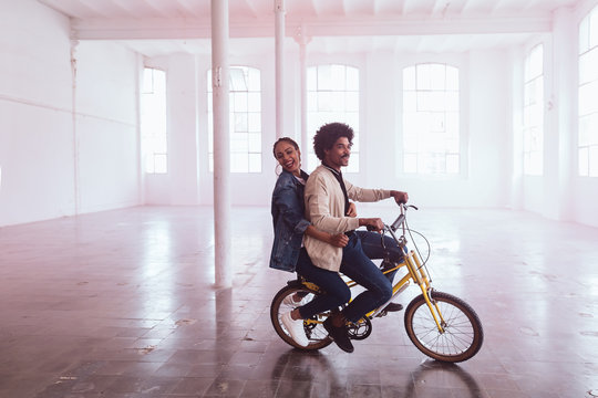 Funny couple with bike. - Powered by Adobe