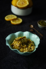 Green pumpkin salad with rice,lemon and mint on dark background. Vegetarian food 