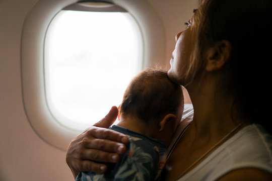 Mother and baby daughter on a plane