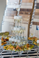 Wedding slide champagne for bride and groom indoors.