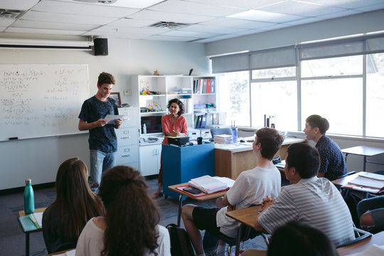 Highschool student giving presentation during class