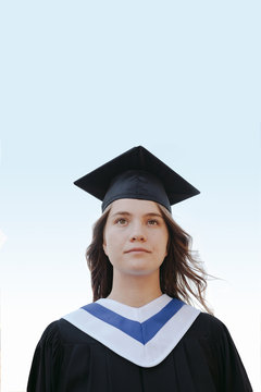Teenage girl wearing cap and gown