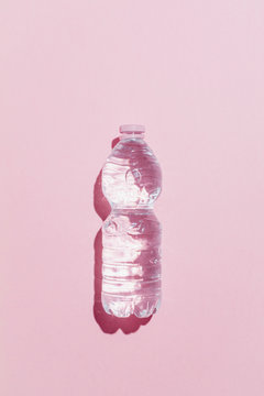 Plastic bottle on pink background. Recycle.