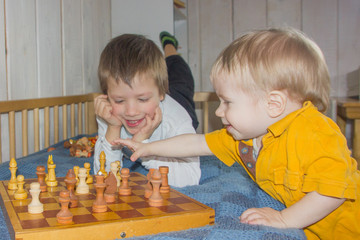 Children play chess. The development of logic, logical thinking. Boys and chess.