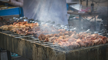 meat on grill.  juicy meat. street food