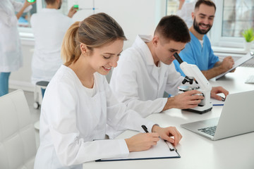 Fototapeta premium Medical students working in modern scientific laboratory