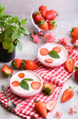 Delicious strawberry mousse with whipped cream.