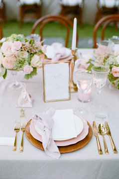 Elegant Outdoor wedding tabletop with florals